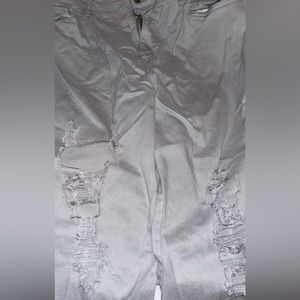 Distressed pale gray jeans